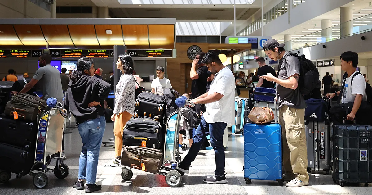 Traveler using doorstep luggage pickup service from airport with suitcases